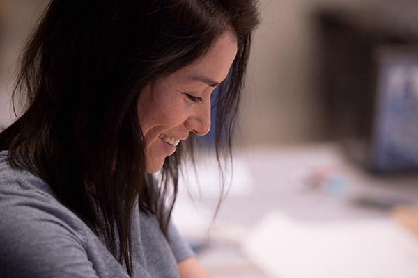 Close up of a female fashion student working on her project in class